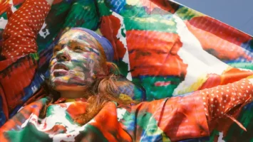 University researchers analysing artificial intelligence models alongside traditional creative materials in a modern academic setting.